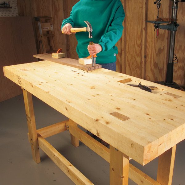 Build a simple, strong workbench made entirely from 2x4s. It's ...