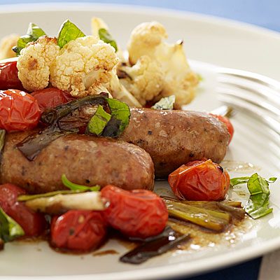 Image of Roasted Sausages With Balsamic Burst Tomatoes And Parmigiano-Reggiano Cauliflower, Rachael Ray Magazine
