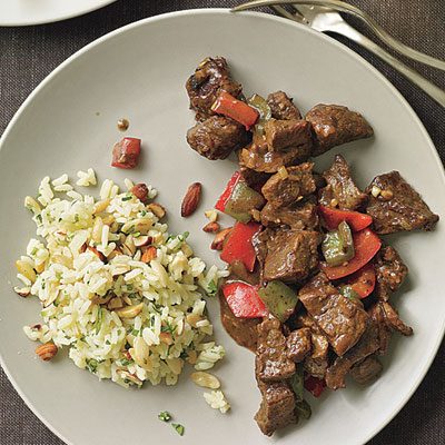 Image of Curry Pepper Beef With Smoked Almond Pilaf, Rachael Ray Magazine